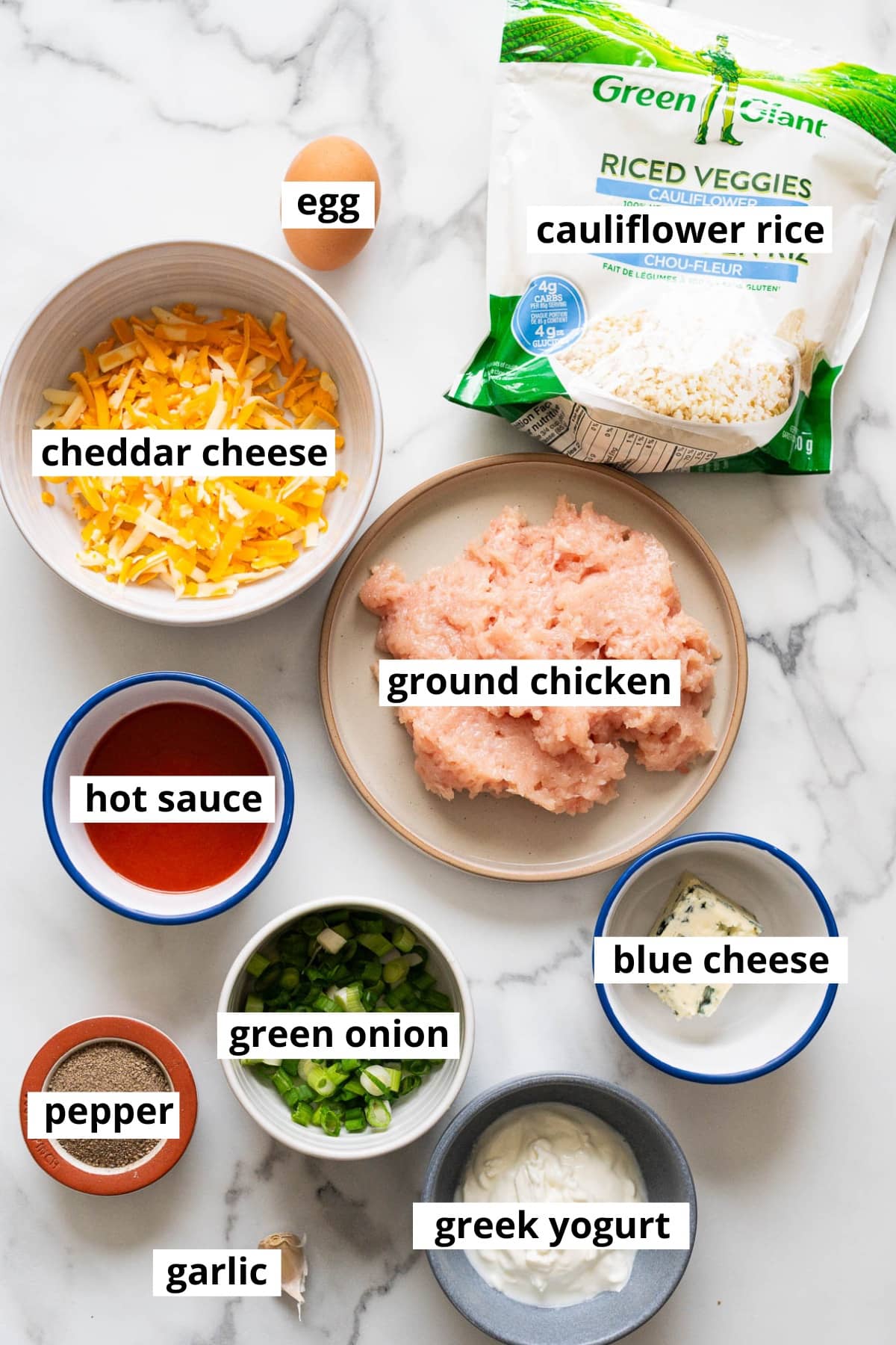 Ground chicken, cauliflower rice, cheddar cheese, hot sauce, egg, green onion, blue cheese, Greek yogurt, pepper, garlic.