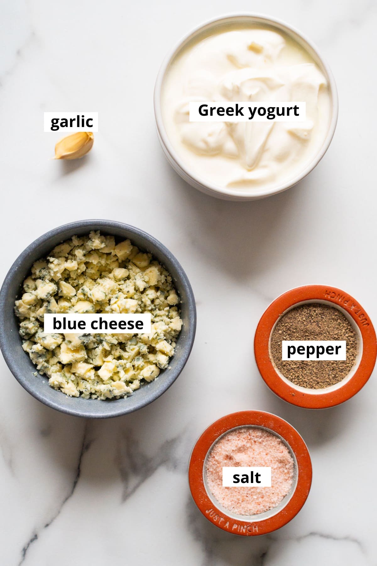 Greek yogurt, garlic clove, salt, pepper, crumbled blue cheese.