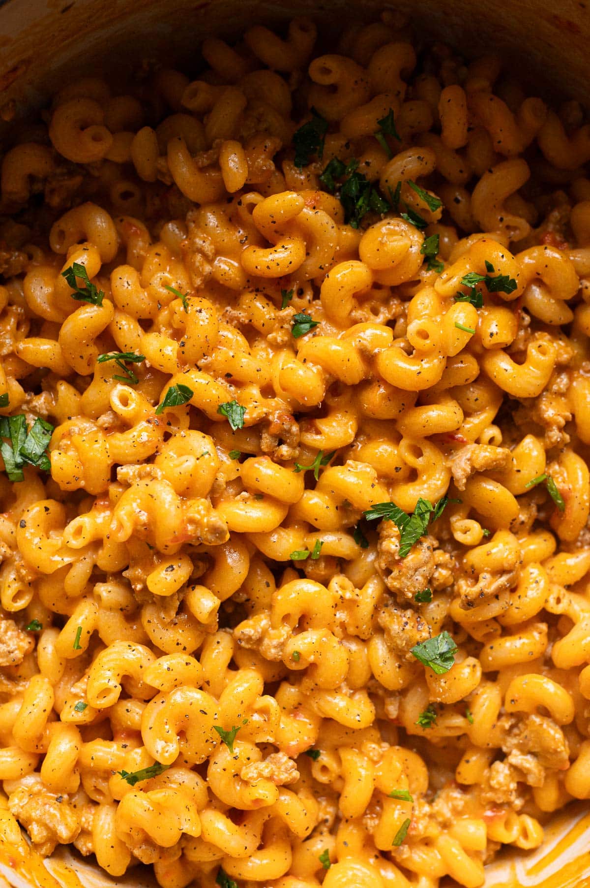 Close up of you of healthier Hamburger Helper garnished with parsley and ground black pepper.