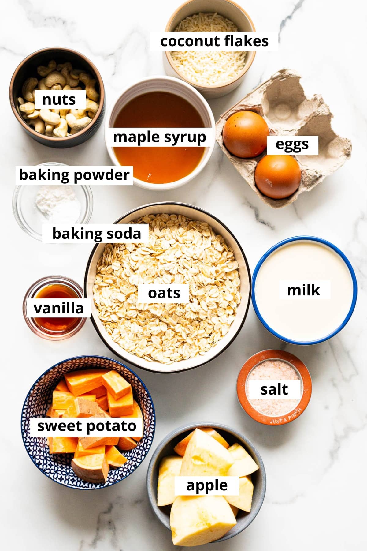 Oats, sweet potato, apple, milk, vanilla, salt, eggs, baking powder, baking soda, cashews, coconut flakes, maple syrup.