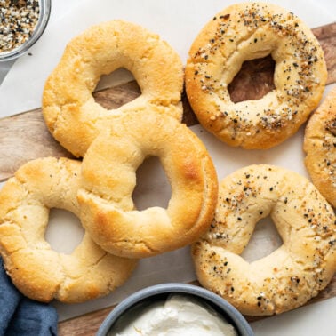 Almond flour Greek yogurt Bagels on a platter with cream cheese and everything bagel seasoning in bowls.