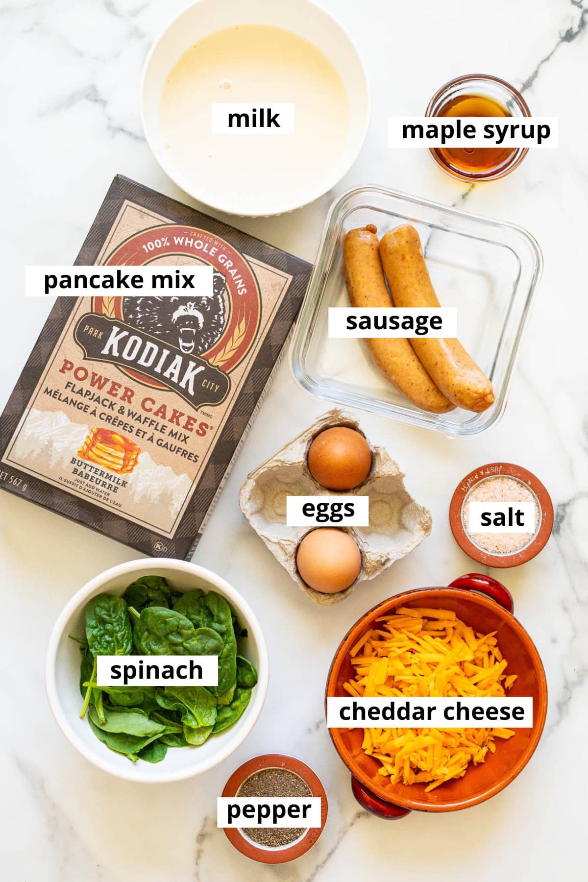 Eggs, pancake mix, sausage, milk, maple syrup, spinach, cheese, salt, pepper.