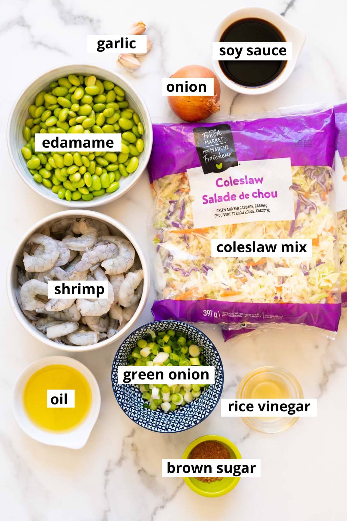 Shrimp, coleslaw, edamame, onion, garlic, soy sauce, green onion, rice vinegar, brown sugar, oil.