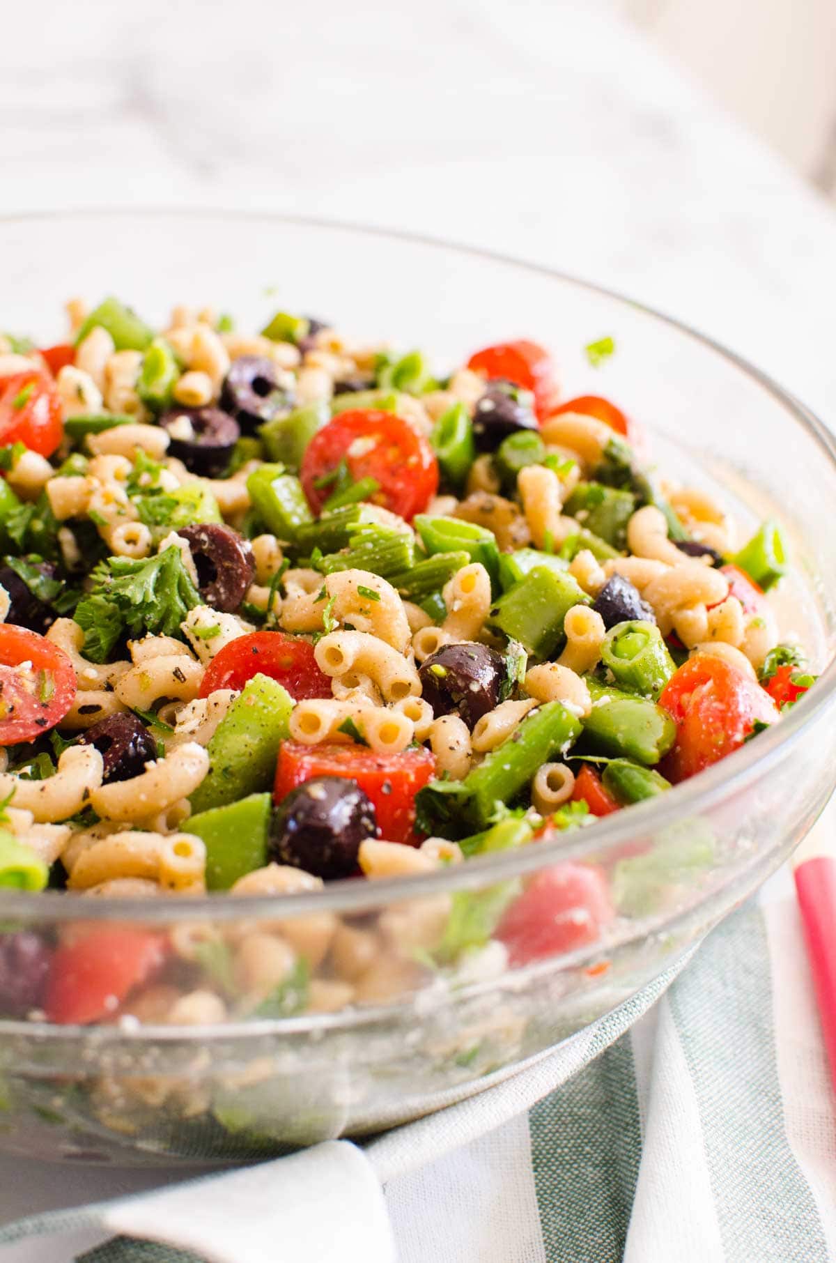 Healthy pasta salad in a glass bowl.