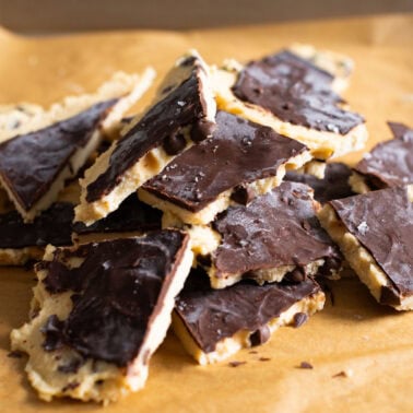 High protein cookie dough bark in a pile on a baking sheet.