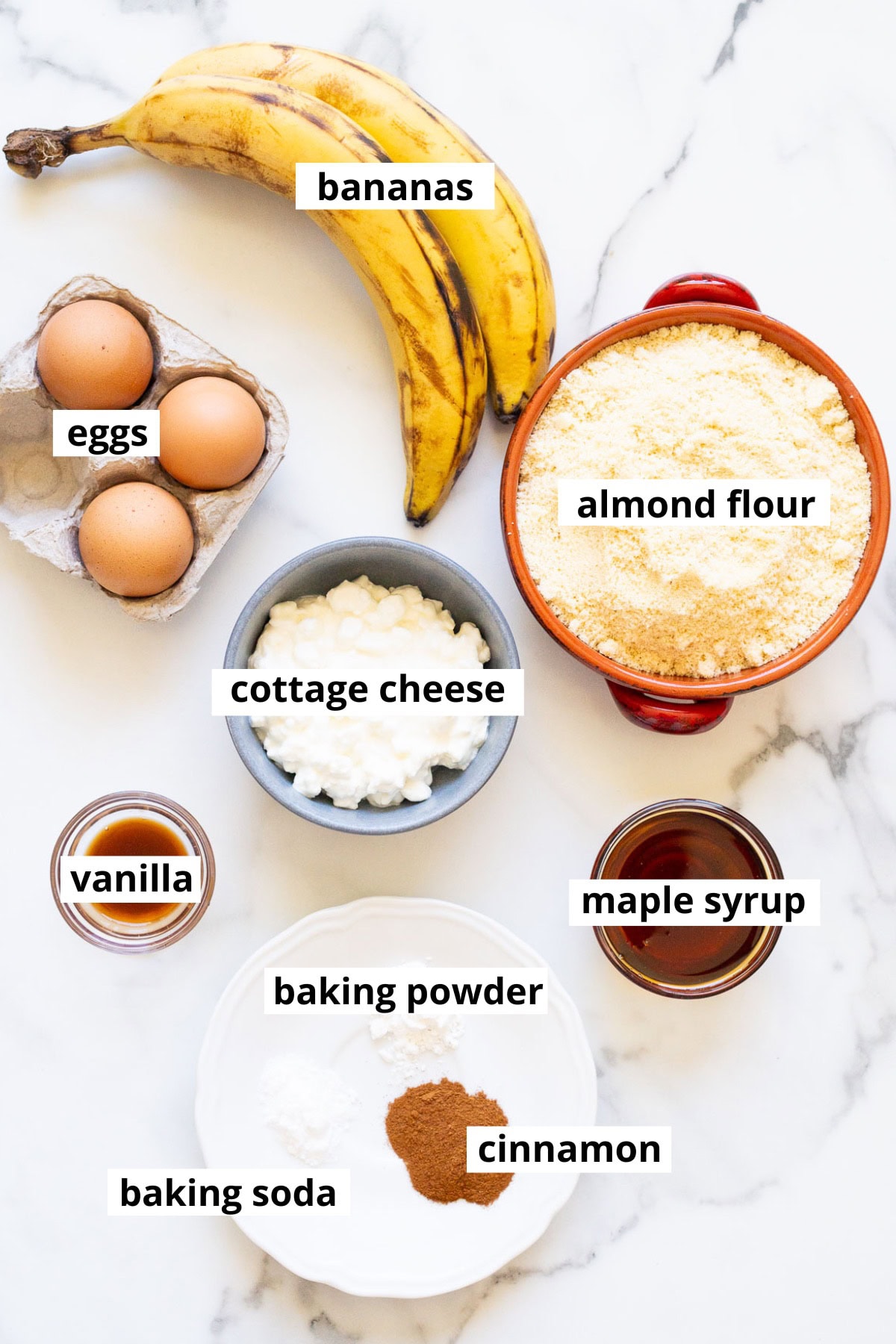 Bananas, cottage cheese, almond flour, eggs, vanilla, maple syrup, baking powder, baking soda, cinnamon.