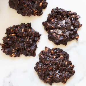 Healthy no bake cookies sprinkled with sea salt on a counter.