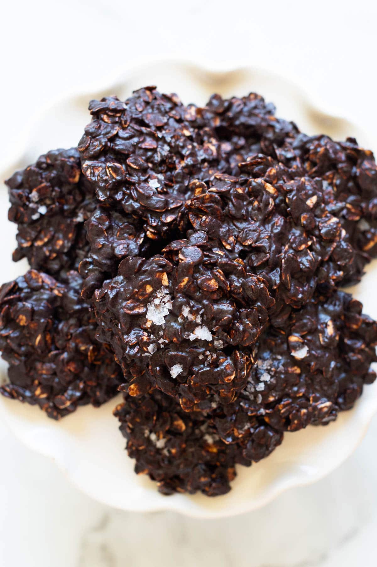 Healthy no bake cookies sprinkled with sea salt on a plate.