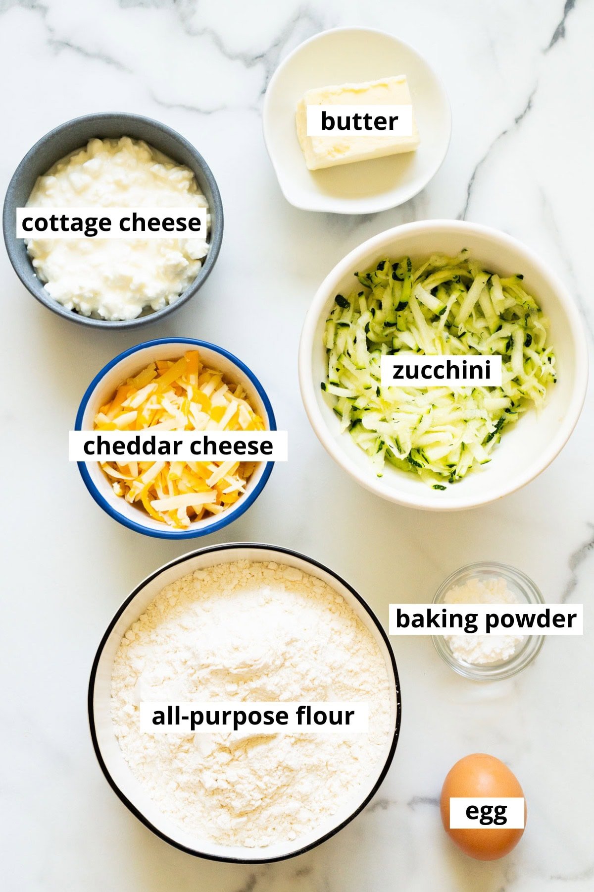 Cottage cheese, butter, zucchini, cheddar cheese, flour, egg, baking powder.