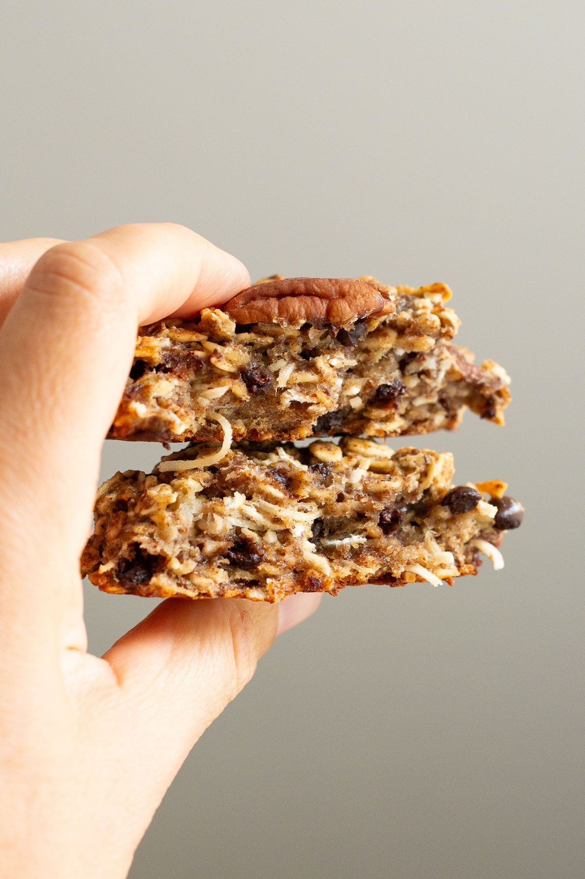 Person holding a cookie showing texture inside.