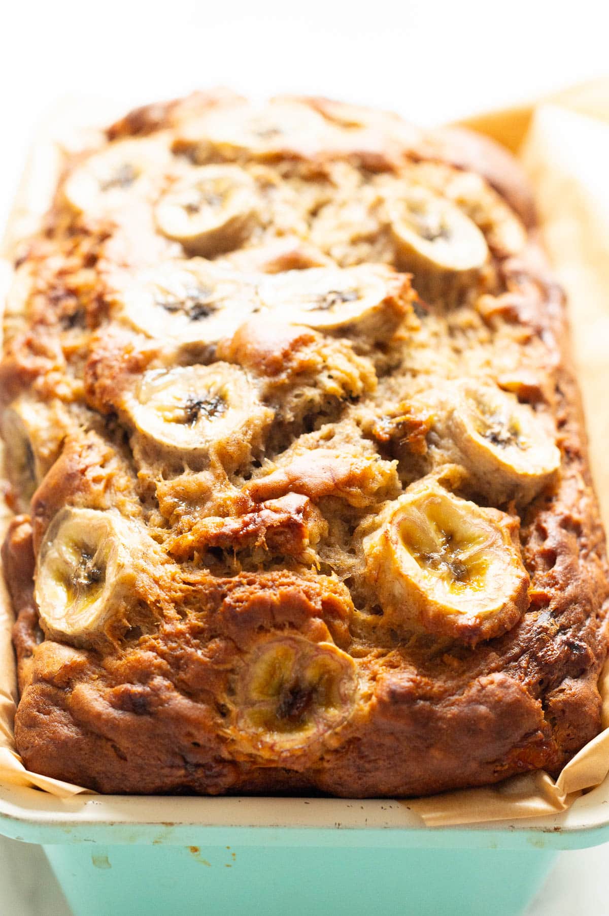 Looking at a loaf of banana bread in baking dish.