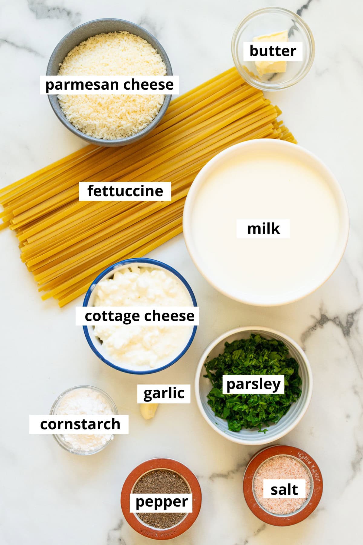 Parmesan cheese, butter, fettuccine noodles, milk, cottage cheese, garlic, cornstarch, parsley, salt and pepper.