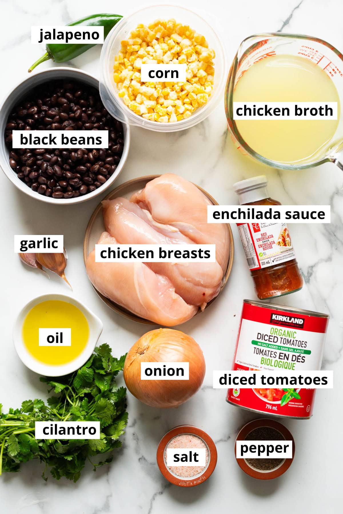 Chicken broth, corn, black beans, jalapeno, chicken breasts, garlic, enchilada sauce, onion, oil, cilantro, diced tomatoes, salt and pepper.