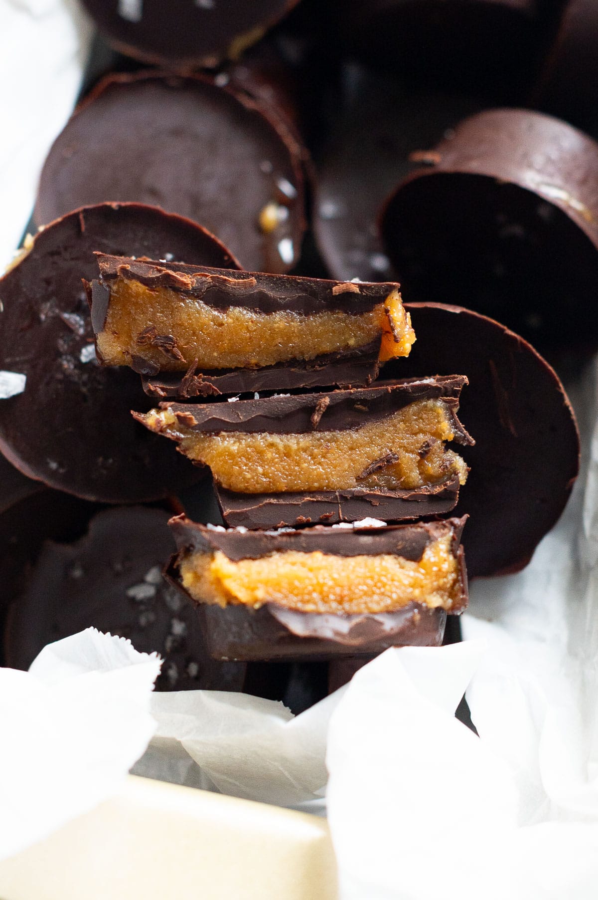 Healthy peanut butter cups showing filling inside.