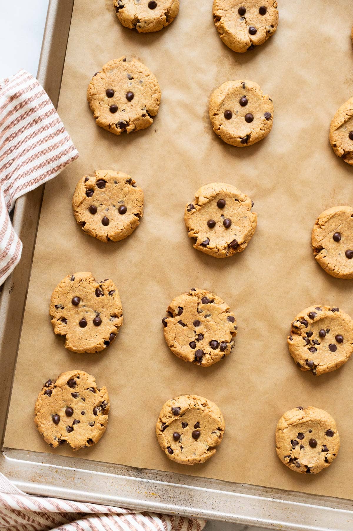 3 ingredient peanut butter cookies on a baking sheet lined with parchment paper.