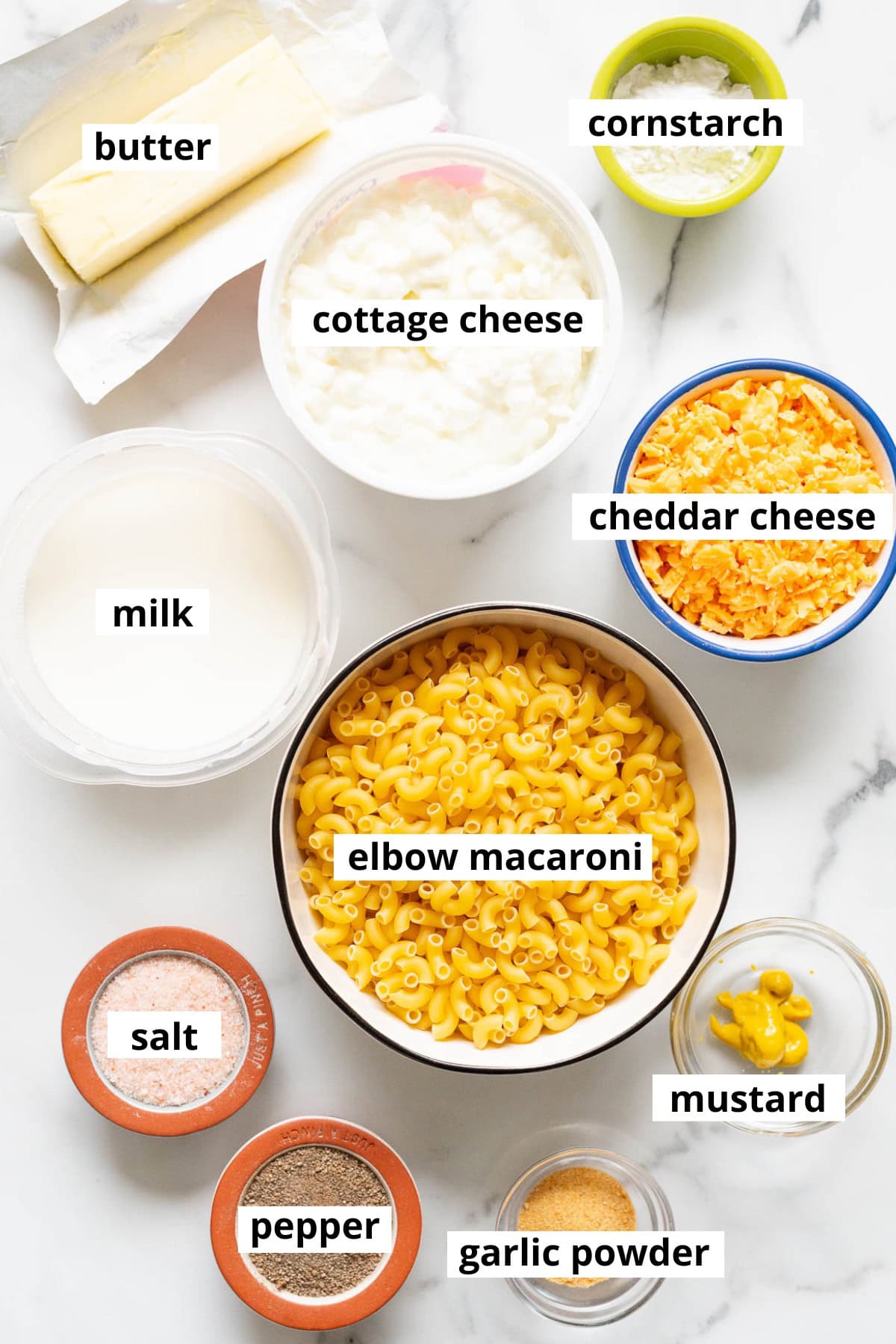 Pasta, cheddar cheese, cottage cheese, milk, cornstarch, butter, salt, pepper, mustard, garlic powder.