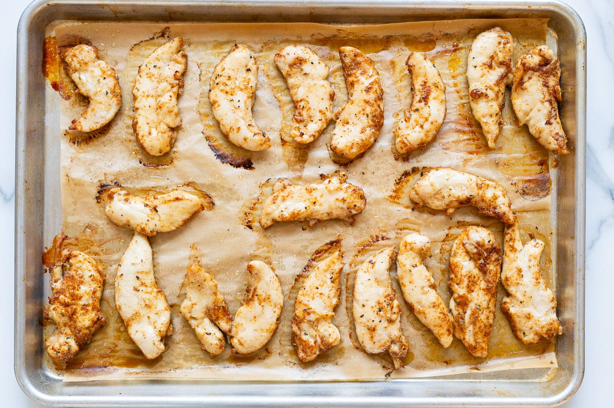 Baked chicken on a baking tray.