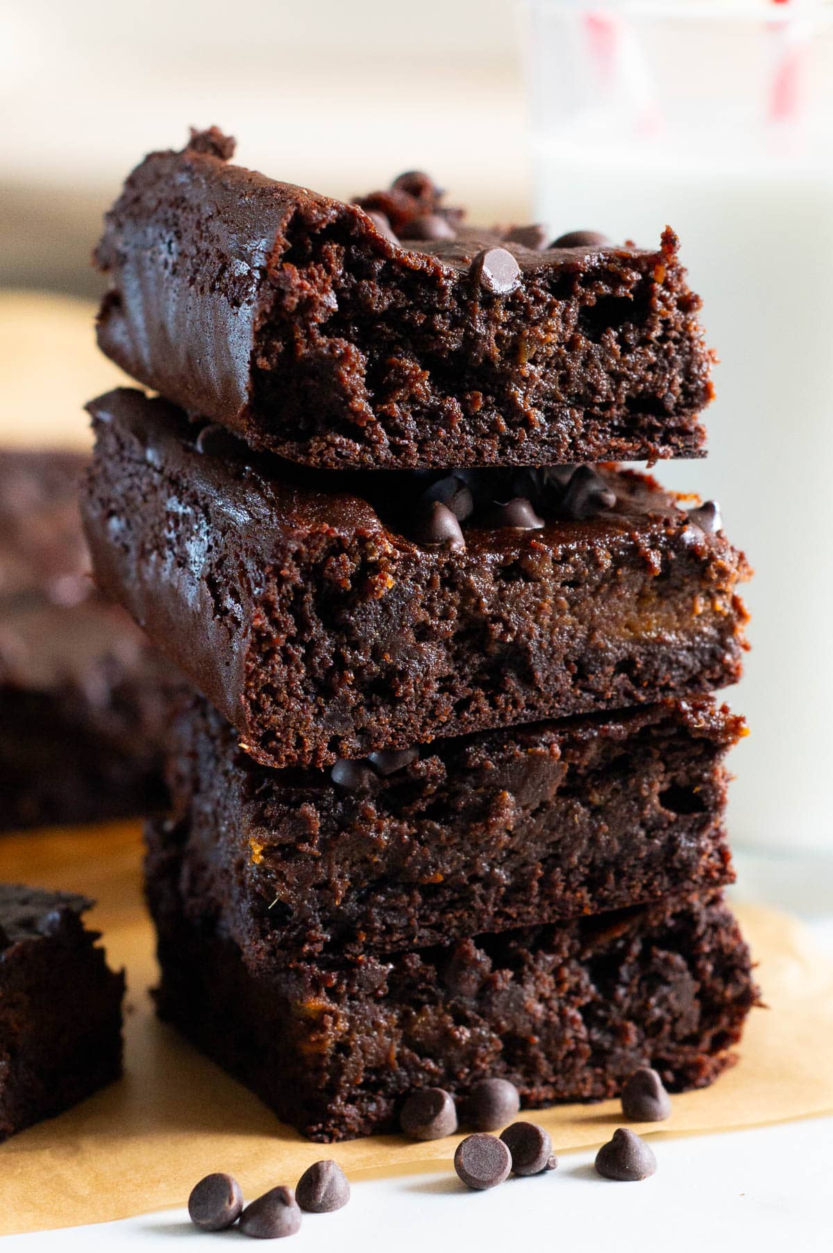 4 sweet potato brownies stacked on top of each other.