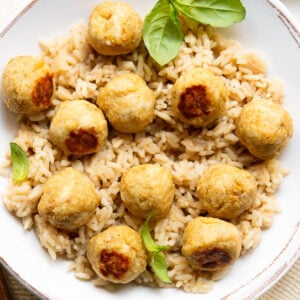 Chicken meatballs served over brown rice.