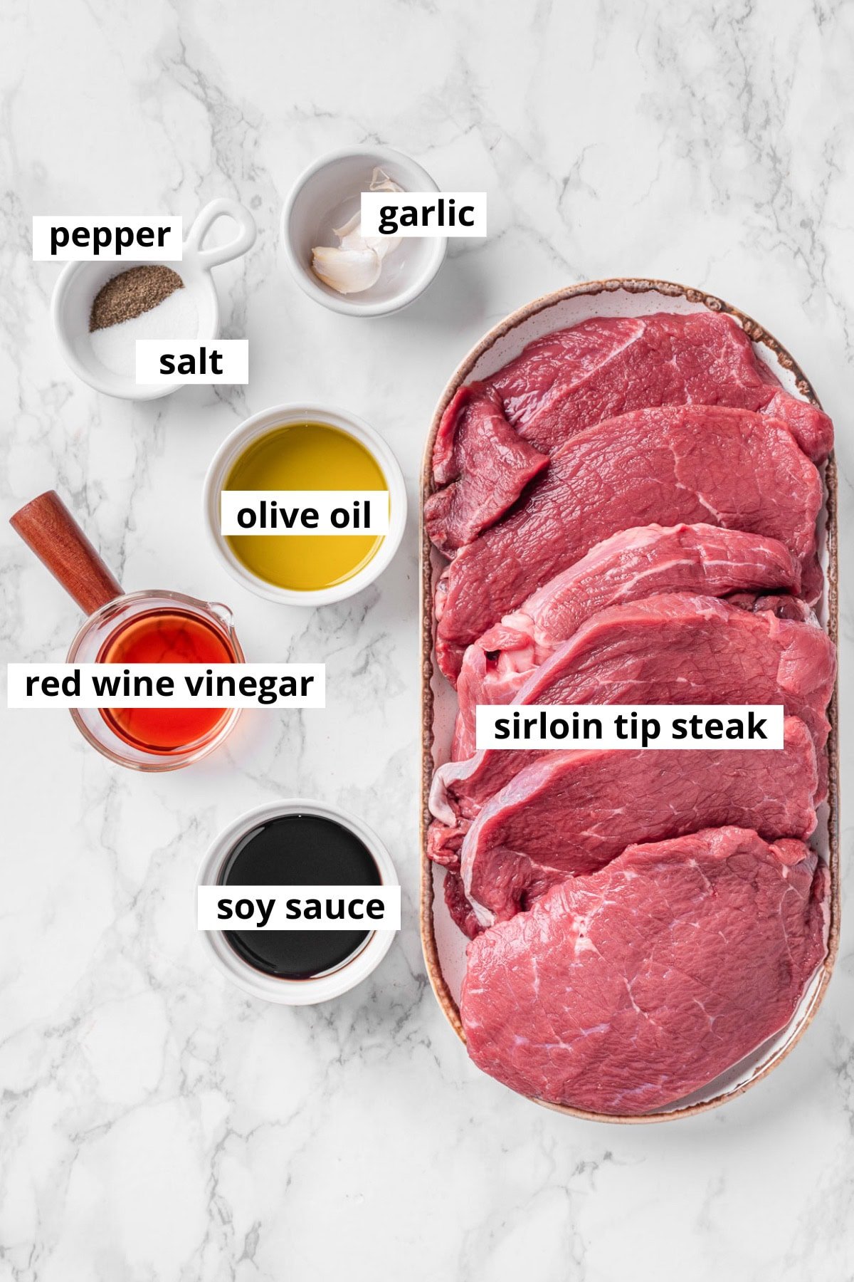 Sirloin tip steaks, garlic, olive oil, red wine vinegar, soy sauce, salt and pepper.