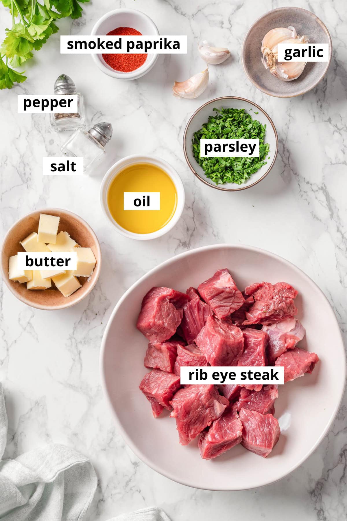 Rib eye steak, garlic, butter, salt, pepper, smoked paprika, oil, parsley.