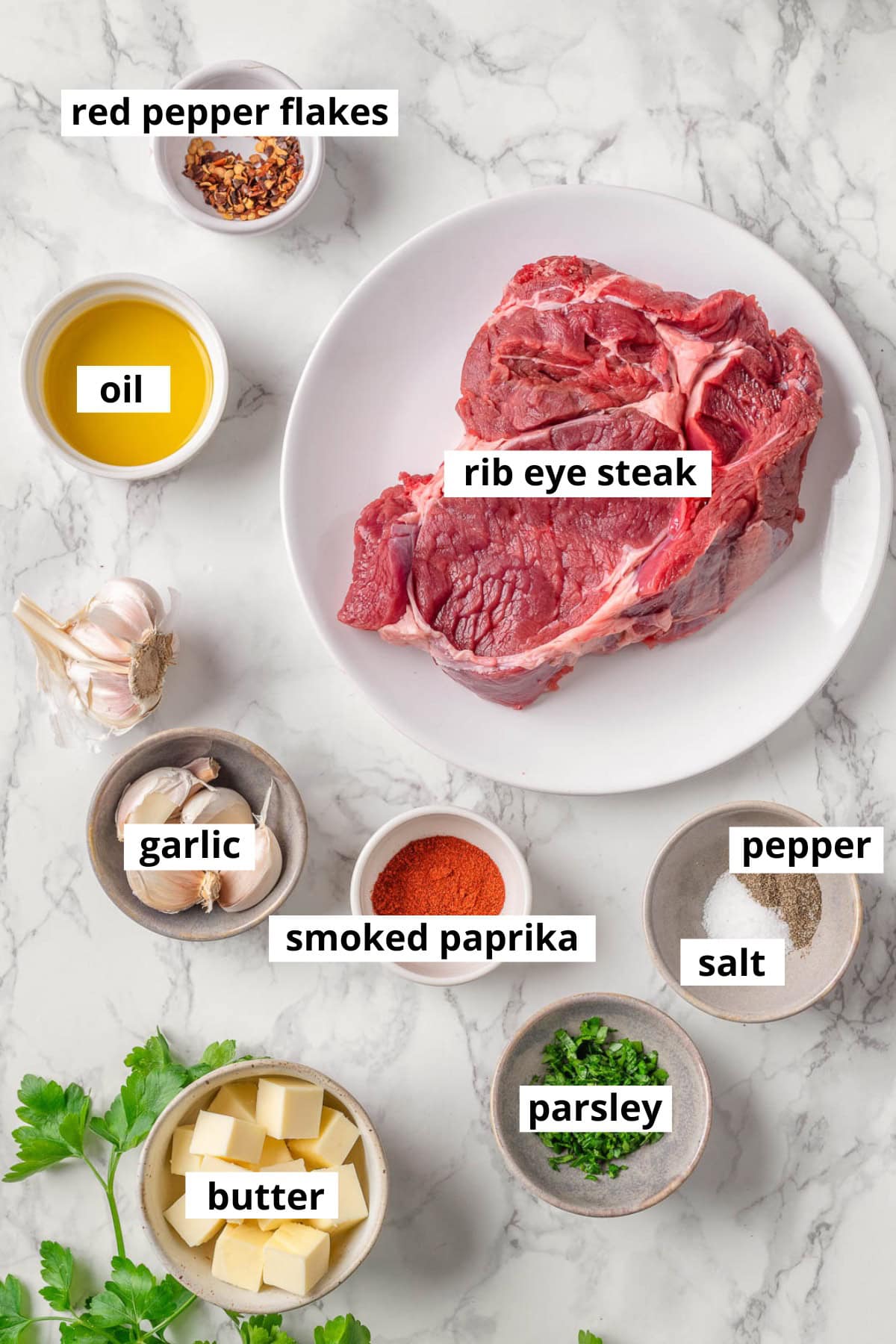 Rib eye steak, garlic, butter, salt, pepper, smoked paprika, oil, red pepper flakes, parsley.