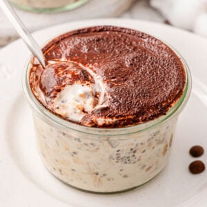 Tiramisu overnight oats in glass jar.