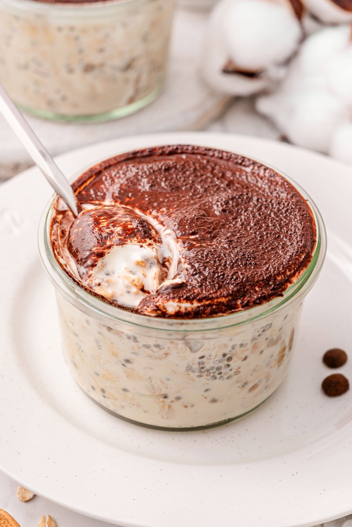 Tiramisu overnight oats in glass jar.
