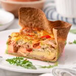 A slice of tortilla quiche on a plate.