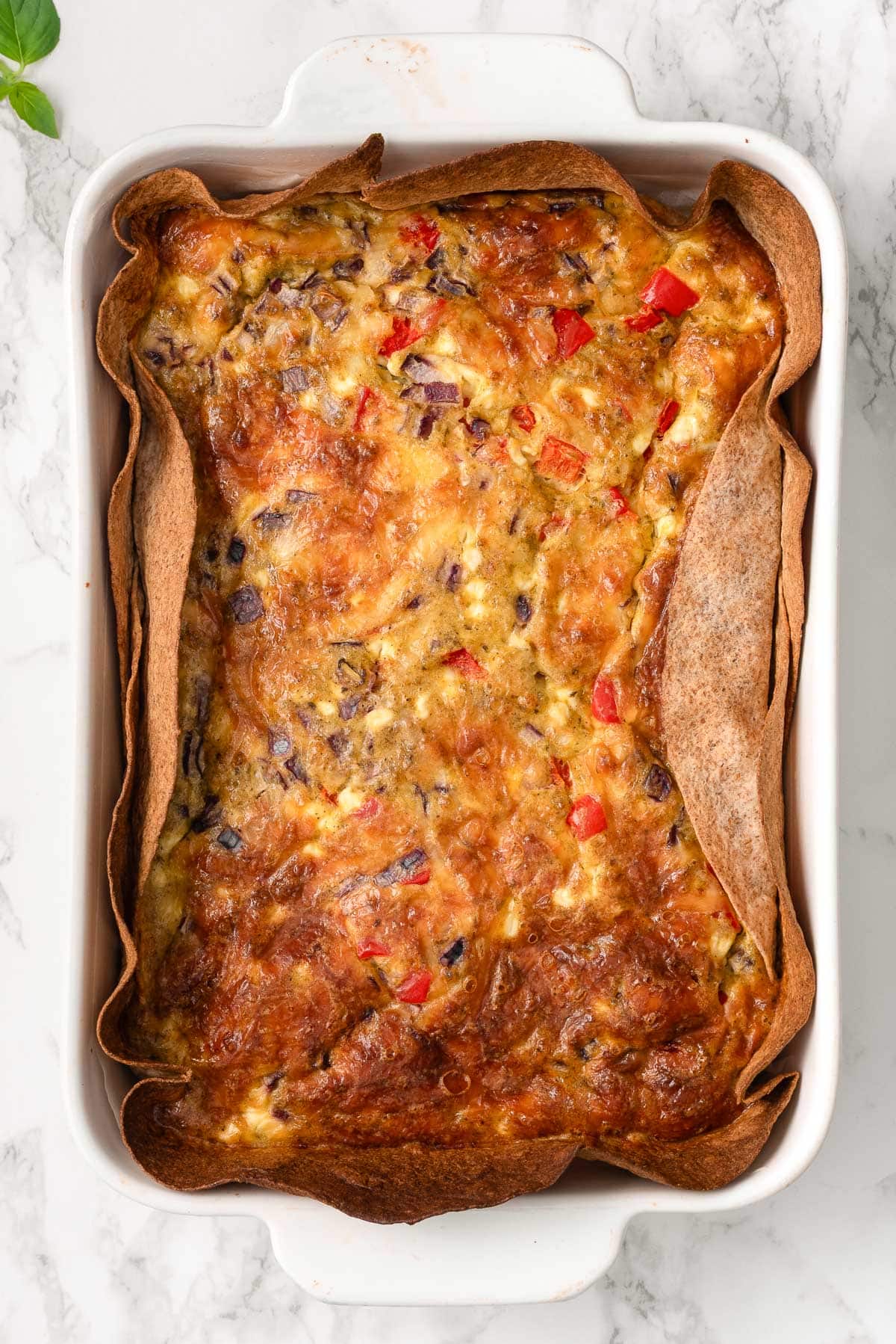 Tortilla quiche in a baking dish.