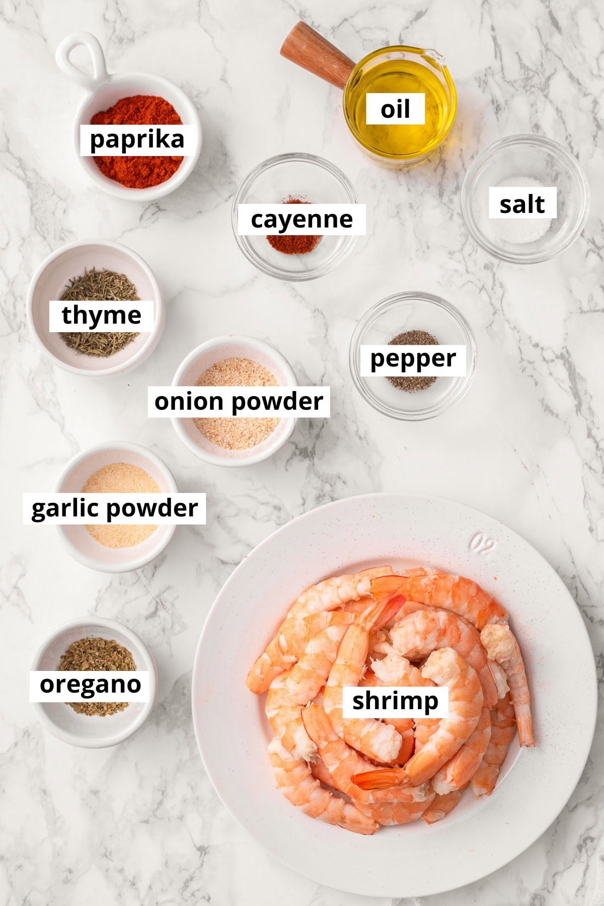 Shrimp, paprika, oregano, thyme, cayenne, onion powder, garlic powder, salt, pepper, oil.