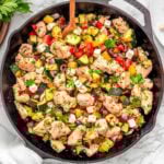 Greek chicken zucchini skillet in cast iron skillet.