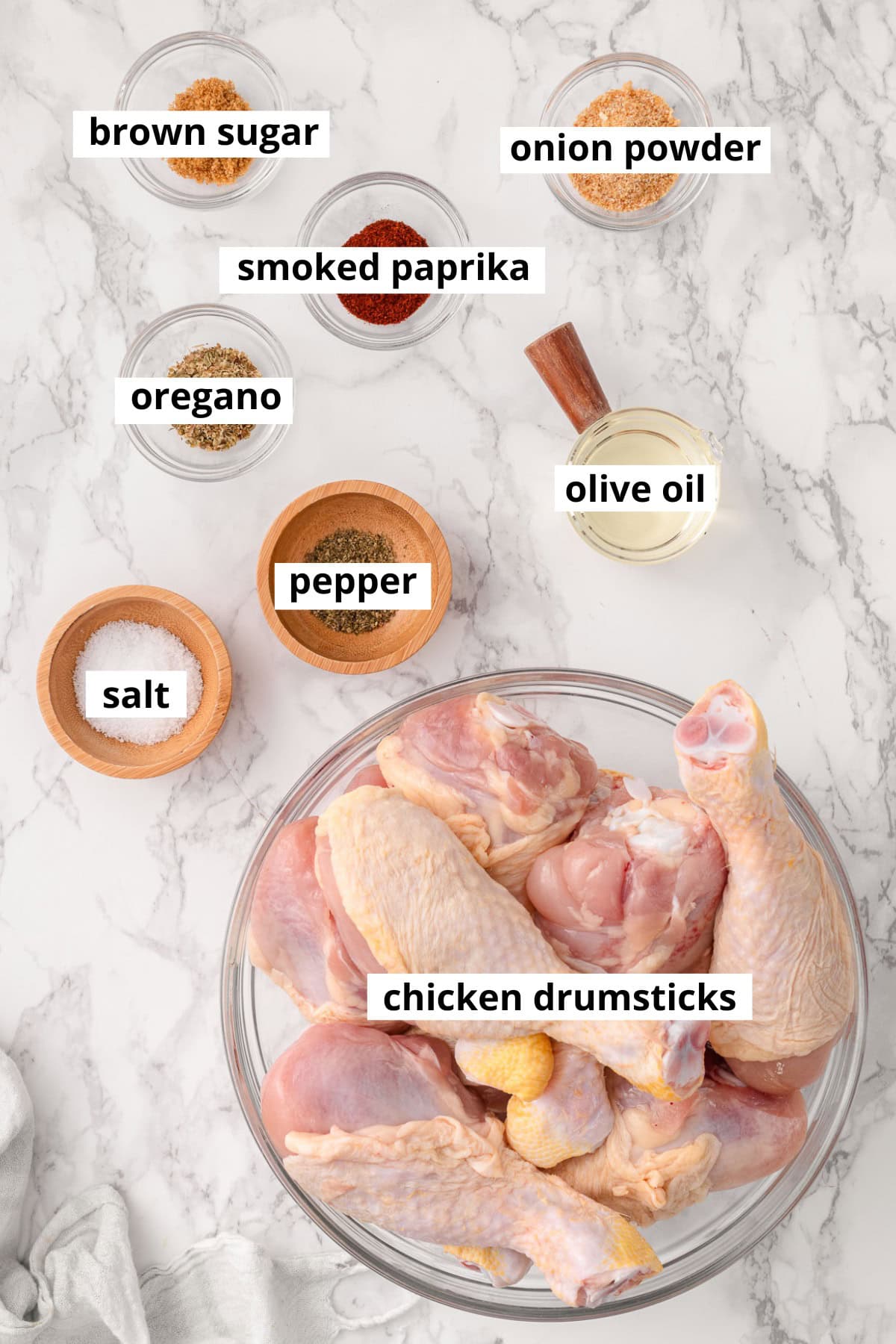 Chicken drumsticks, oil, salt, pepper, oregano, smoked paprika, onion powder, brown sugar.