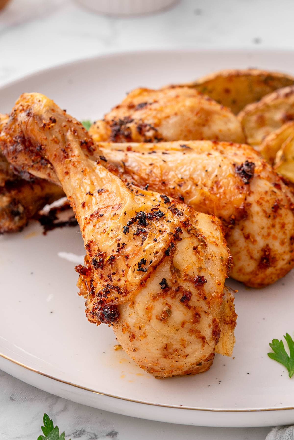 Closeup of oven baked chicken drumstick.