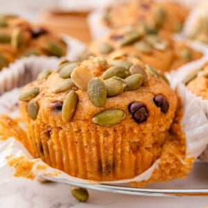 Cottage cheese pumpkin muffins on a wire rack.