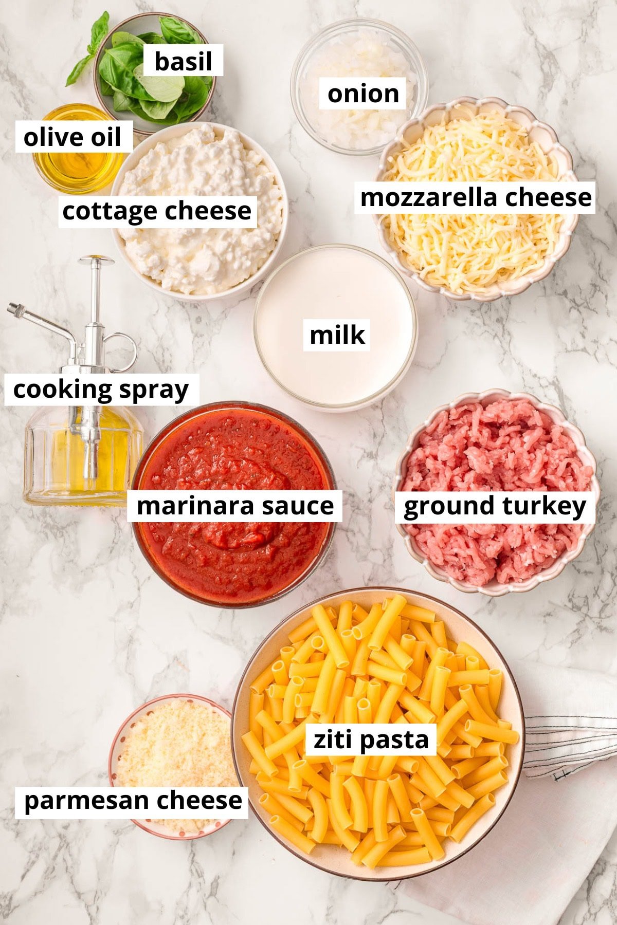 Ziti pasta, ground turkey, milk, cottage cheese, olive oil, basil, onion, mozzarella cheese, parmesan cheese, marinara sauce, cooking spray.