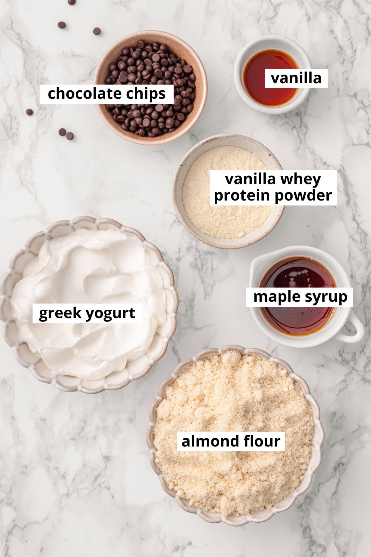 Greek yogurt, vanilla whey protein powder, chocolate chips, vanilla, almond flour, maple syrup.