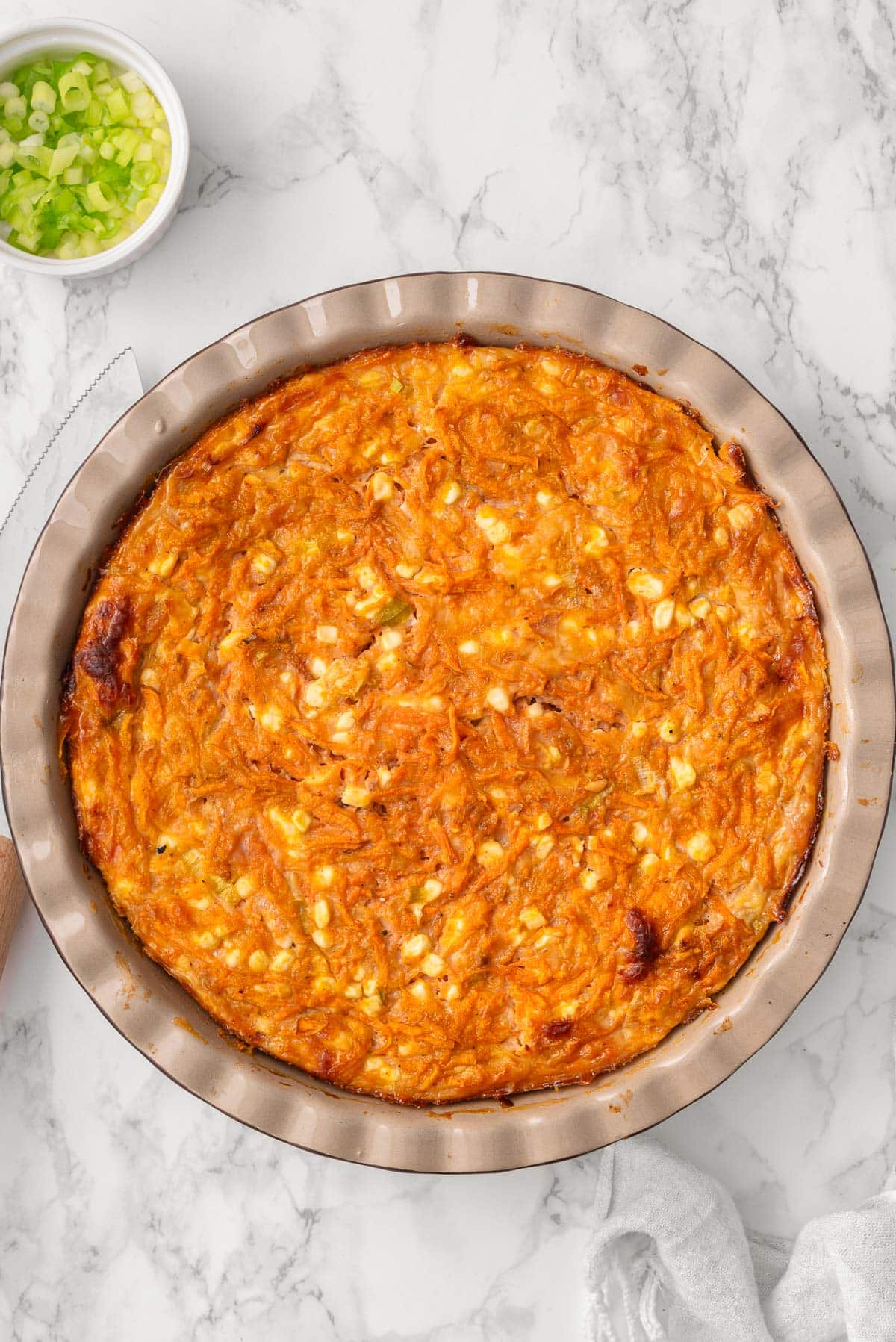 Crustless cottage cheese sweet potato quiche in a pie dish.
