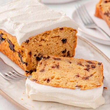 Sliced cottage cheese pumpkin bread with frosting.