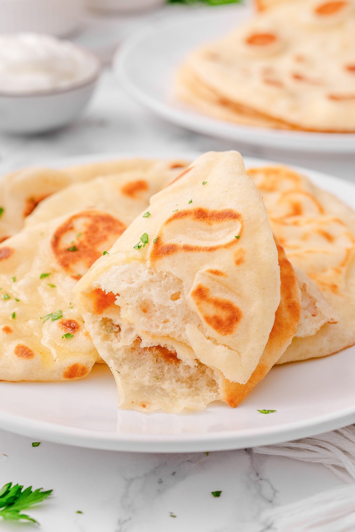 Half of greek yogurt naan showing texture.