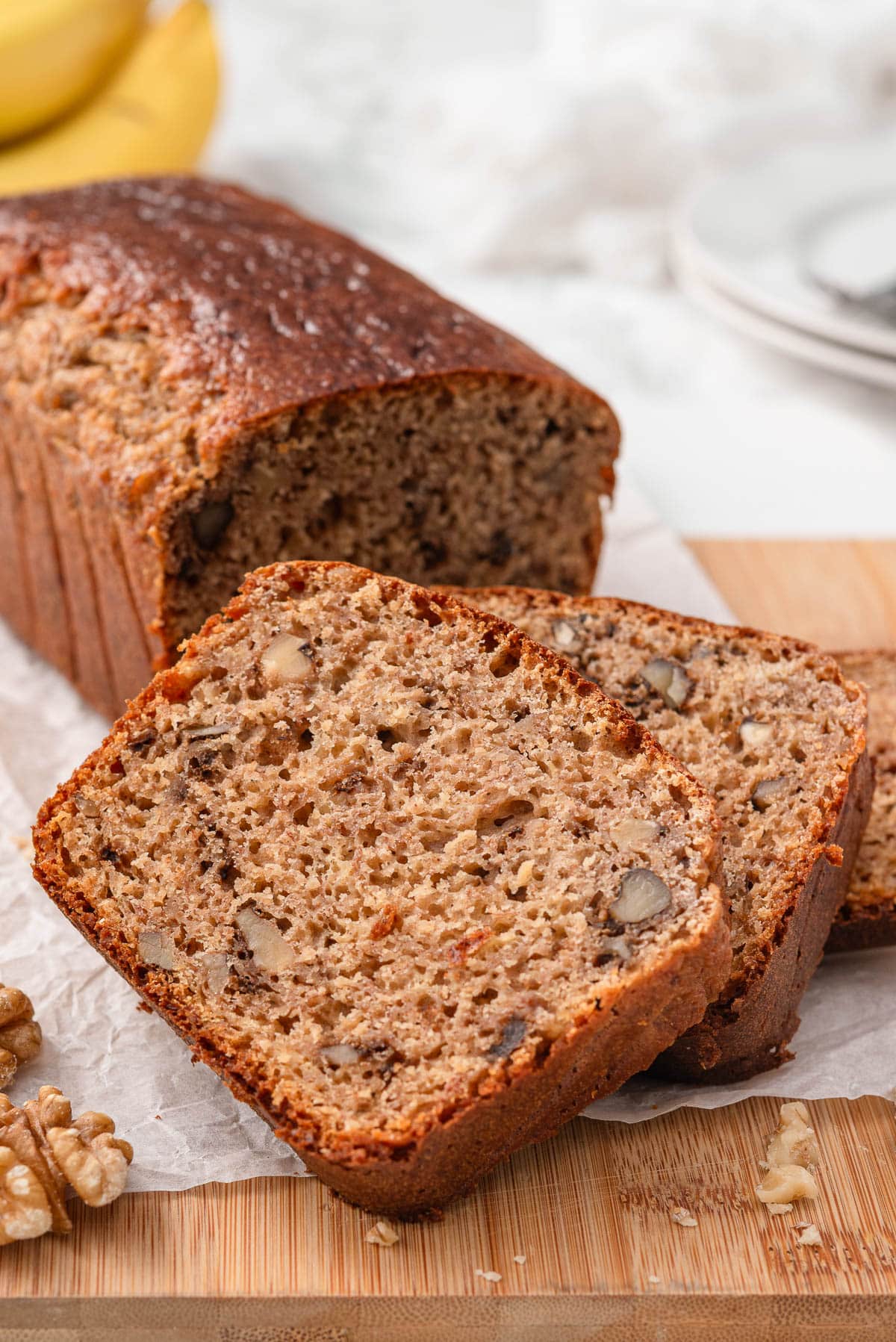Kodiak banana bread sliced on a board.