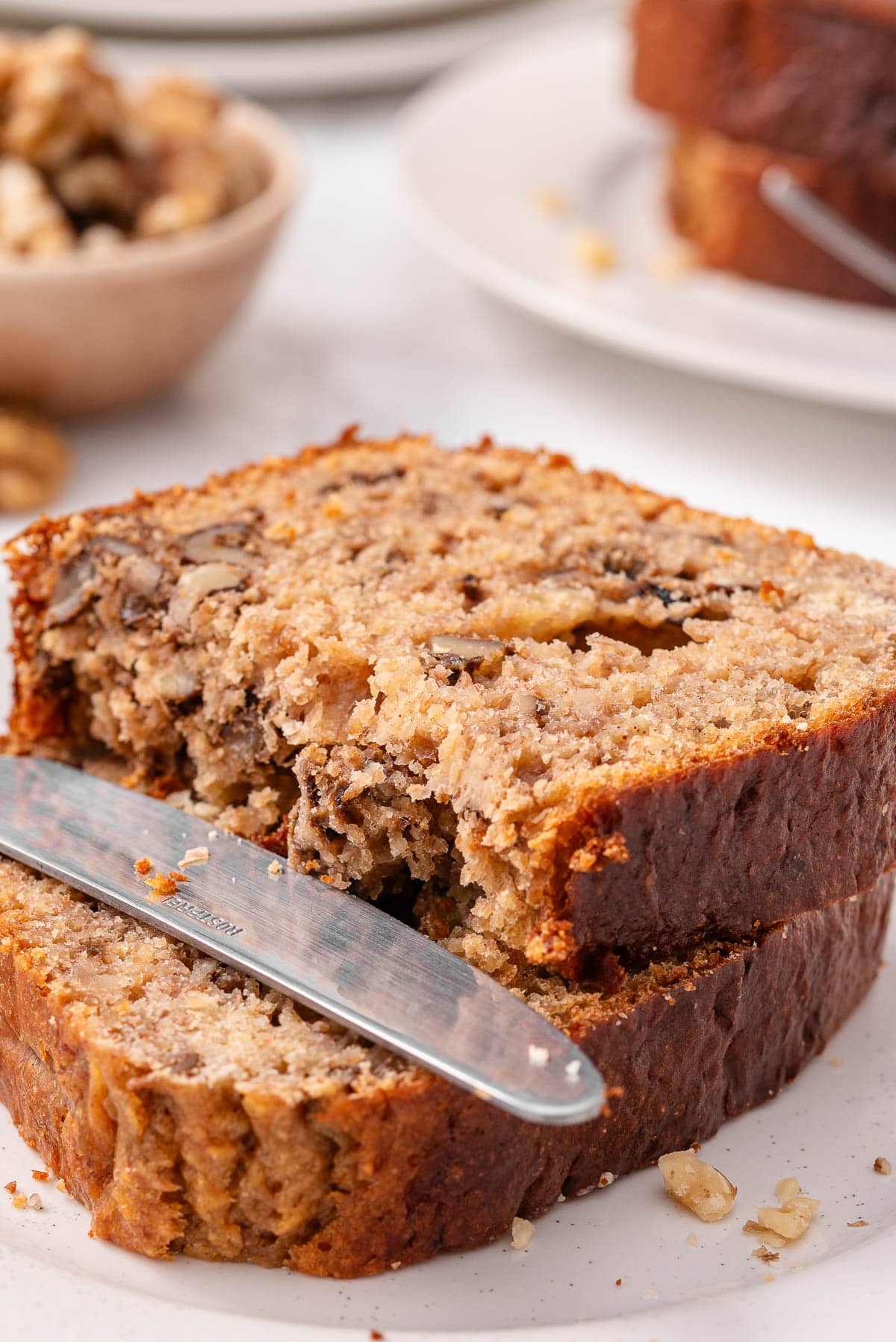 A slice of kodiak banana bread with walnuts showing texture.