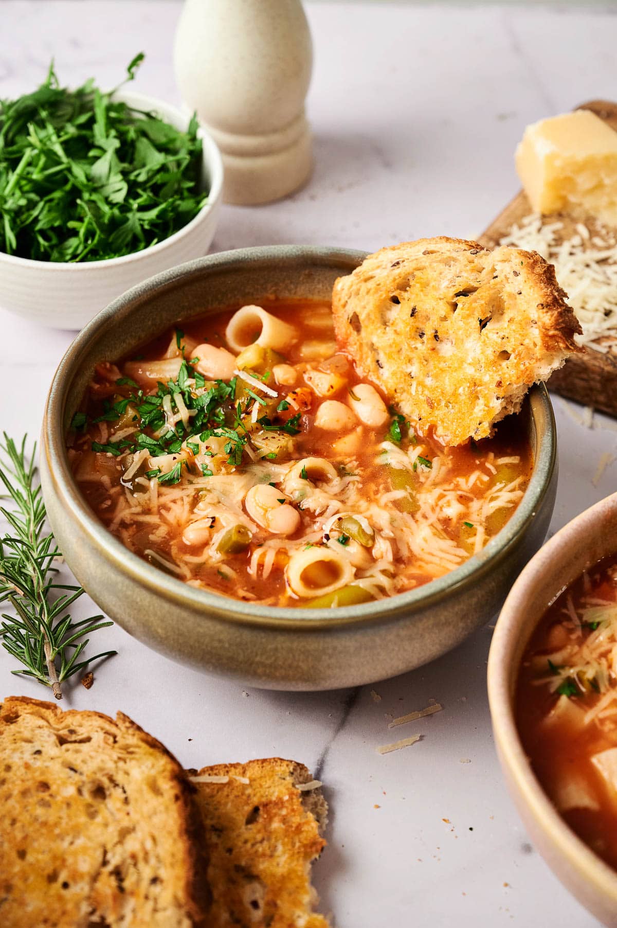 Minestrone soup in a bowl with bread.