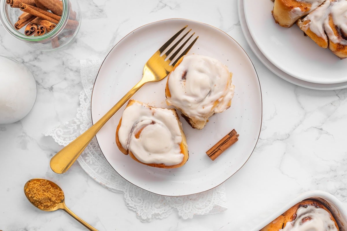 Cottage cheese cinnamon rolls on a plate with a fork.