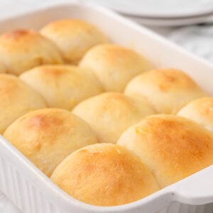 Greek yogurt dinner rolls in a baking dish.