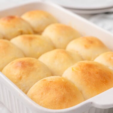 Greek yogurt dinner rolls in a baking dish.