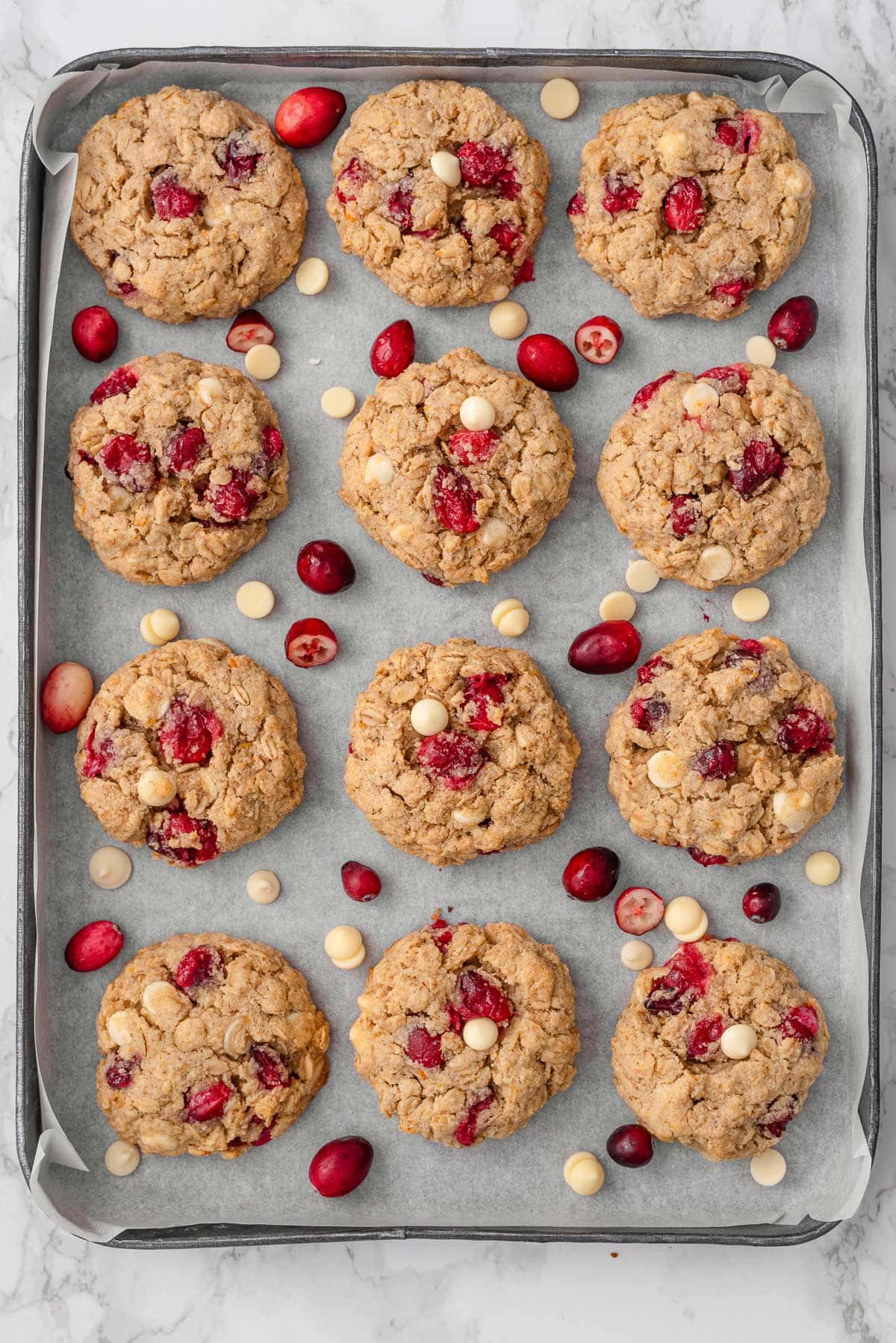 Healthy oatmeal cranberry cookies on a baking sheet.