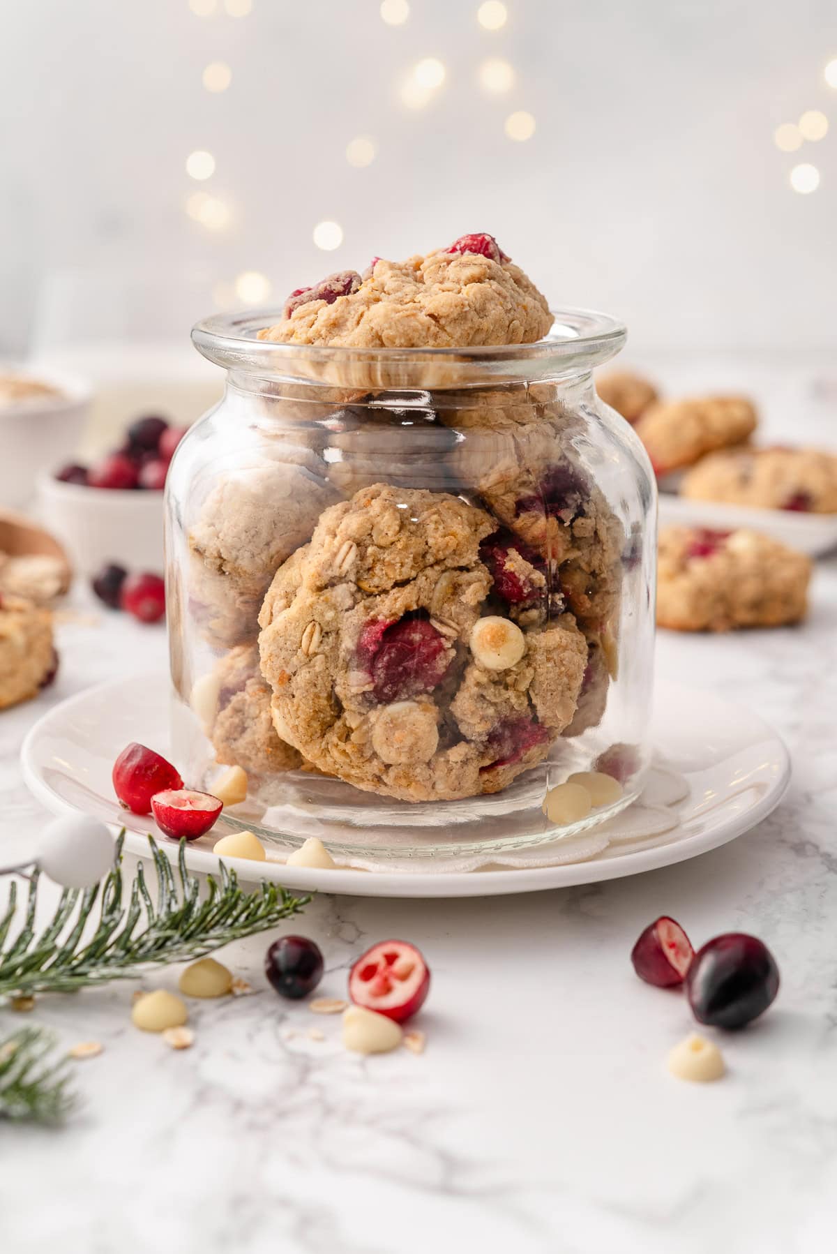 Healthy oatmeal cranberry cookies in a glass jar.