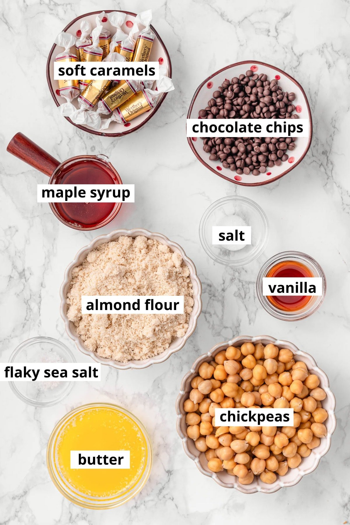 Chickpeas, maple syrup, soft caramels, vanilla, chocolate chips, salt, flaky sea salt, almond flour, melted butter.