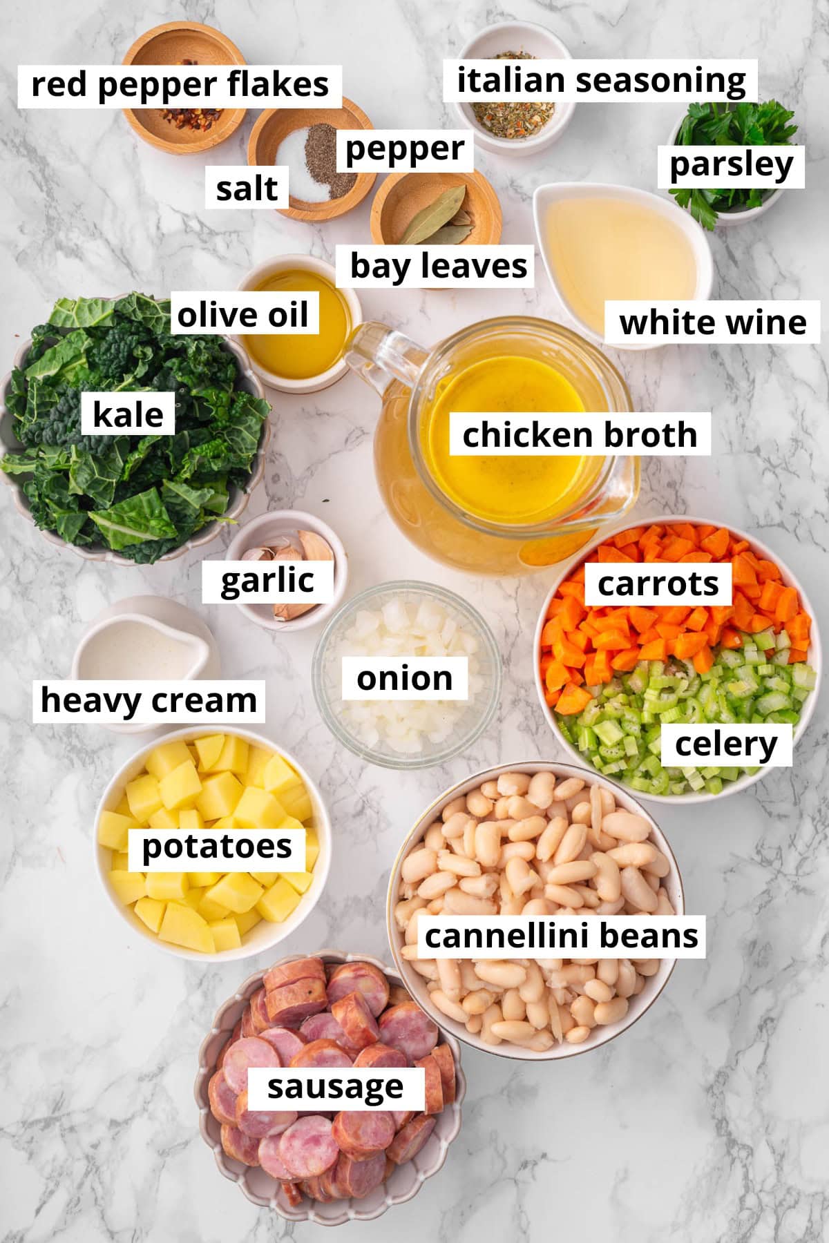 Cannellini beans, carrots, onion, celery, garlic, kale, olive oil, italian seasoning, red pepper flakes, salt, pepper, white wine, parsley, sausage, potatoes, heavy cream.